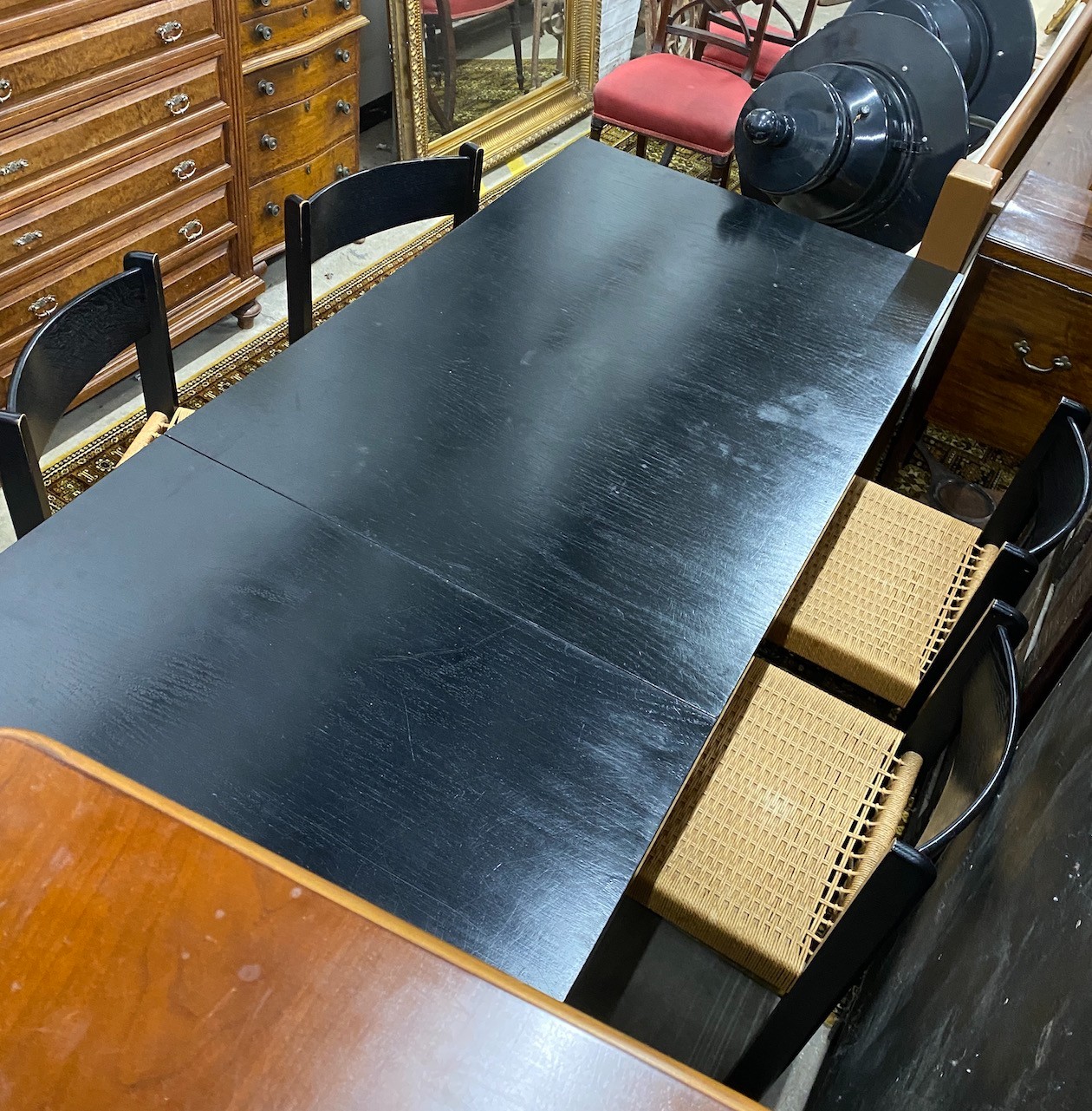 A 1970’s Habitat black ash rectangular dining table, length 194cm, width 90cm, height 74cm and four chairs, width 47cm, depth 46cm, height 79cm